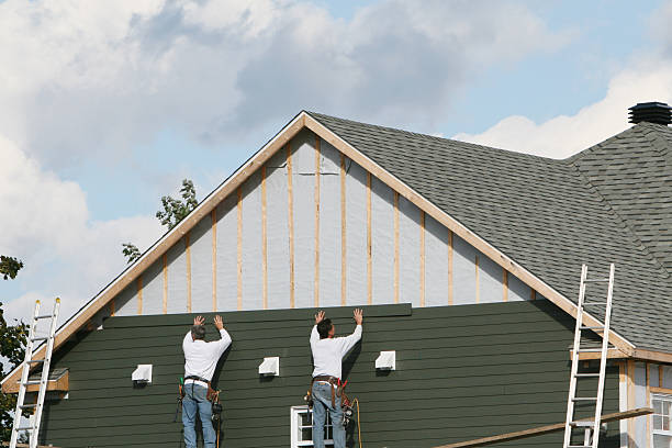 Professional Storm Damage Siding Repair technician working in Vass, NC